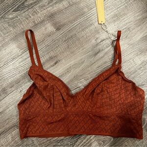 SKIMS logo triangle bralette